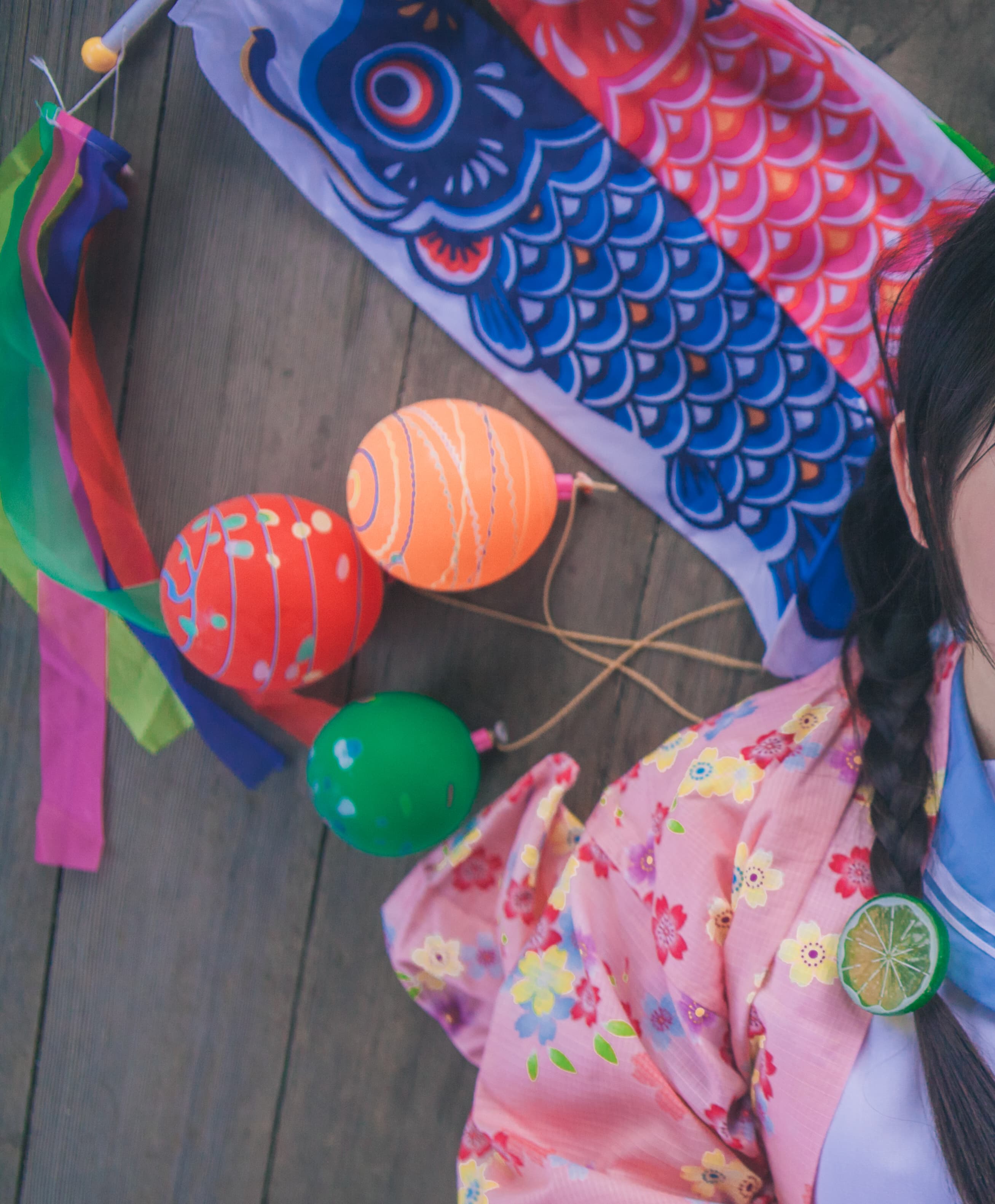 Woman seated in a kimono with one stocking slipping to reveal a delicate bare foot